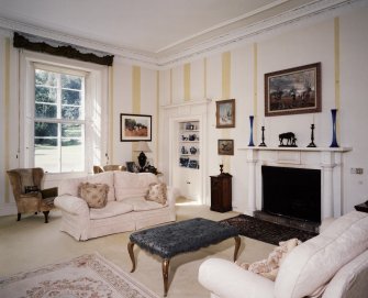 Interior. East wing Drawing room showing early 19th century fireplace and lying pane glazing