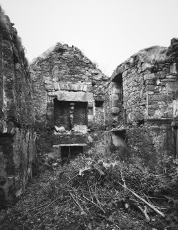 View of ruined interior from W.
