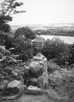 View of ornamental urn and view beyond from E.