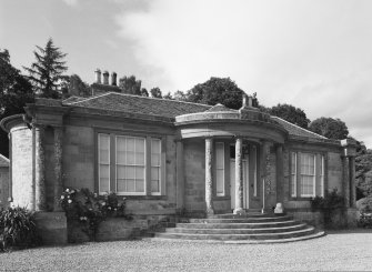 View of frontage and bowed columned entrance porch from SSW