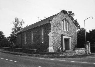View from road, showing length of church and entrance.