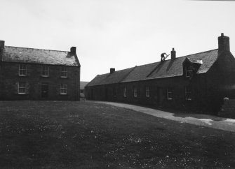 View of section of S and E side, showing no. 9, Orchard House, on the left.