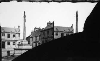 NMRS survey of Private Collections.  Stereoscopic view of Melrose, Market Place.  A view NE to Market Cross and S end of Abbey Street.  Original glass plate is badly damaged.
Copied from an original plate by Thomas Begbie taken in c. 1860.