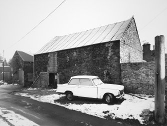 View of outbuilding from NW.