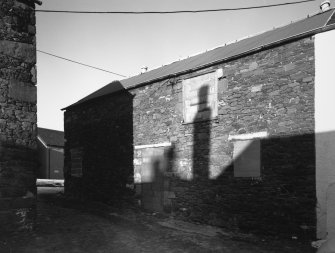 View of outbuilding from SW.