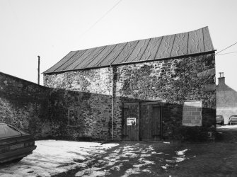 View of outbuilding from SE.