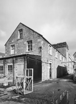 Selkirk, Dunsdale Haugh, Dunsdale Road, Riverside Mills
View from south of south west end of engineers' shop, with former engine house in background