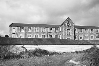Selkirk, Dunsdale Haugh, Dunsdale Road, Riverside Mills
View from south east of New Mill (1863), with the lower floor obscured by a single-storeyed wooden waste wool store in the foreground