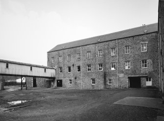 Selkirk, Dunsdale Haugh, Dunsdale Road, Riverside Mills
View from south of south west side of original spinning mill, showing its 'T'-shaped plan, its north-west leg being visible to the left, and part of the south-west leg to the right . At the time of the survey, the mill was used predominantly as a warehouse.