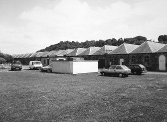 General view from W to NW side of single-storeyed weaving sheds (building Nos 12, 13, 26 and 26A, respectively former drawing and warping, picking, darning and mending, wool store and wool sorting Dept.