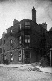 Copy of historic photograph showing view of Burgh Arms Public House.