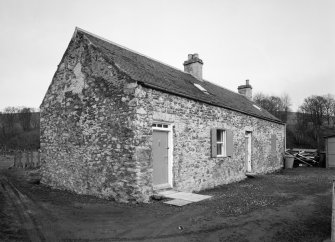 View of neighbouring cottage from SW.