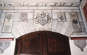 Interior. Anteroom. Detail of frieze above doorway with inscription "SERO SED SERIO"