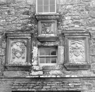 Detail of armourial panels above door to NW (principal) elevation