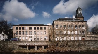 Hawick, Commercial Road, Wilton Mill
View from south east of central blocks at heart of Wilton Mills, with tailrace outlets into River Teviot in foreground