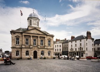 View of town hall from W showing 1-5 Woodmarket in the background