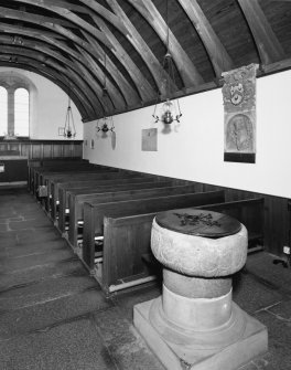 Interior. View of nave showing pews