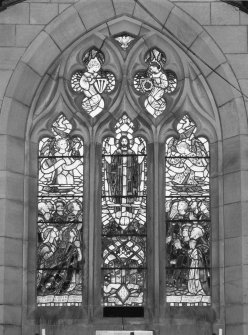 Interior. Chancel. Detail of stained glass 3-light pointed arch window to E gable