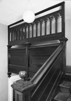 Interior.
View of staircase from half landing showing gothic screen.