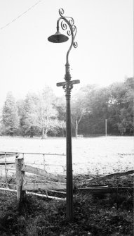 Detail of lampost dated 1897 to NE of hosue.