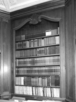 Interior. Octagonal library detail of panelling and bookcase