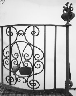 Interior. Spiral stair detail of Thomas Hadden wrought iron balustrade with curling equpment