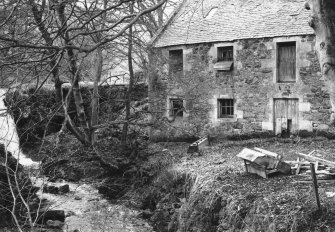 View from SE showing entrance and SW bays next to waterfall.