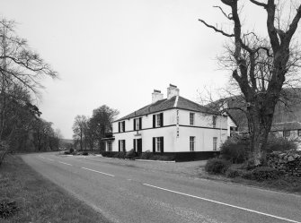 View from NE showing E elevation to road.