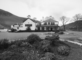 View from S showing main entrance and service buildings.
