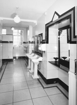Interior.
Gentlemen's toilet, view from S showing original wash hand basins and 'Vitrolite' panels.