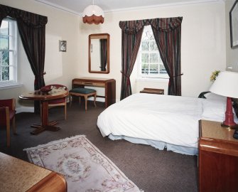 Interior.
First floor, SE bedroom, view from NW showing 1930's furniture.