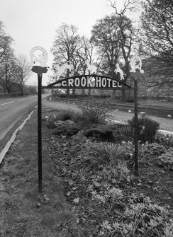 Detail of roadside 1930's 'Crook Hotel' sign to S attributed to Thomas Haddon and Company.