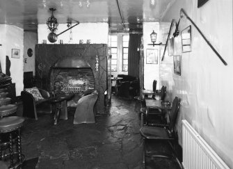 Interior.
Willie Wastle's bar, view from S showing circular fireplace and original 1930's 'Swiss' furniture.