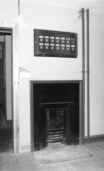 Interior. Bell board above fireplace, detail