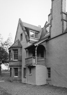 W front, gabled bay with two-storey canted windows and adjacent balcony with decorative timber balustrade and line of original timber staircase