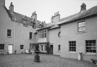 View of buildings facing courtyard with dining room oriel window