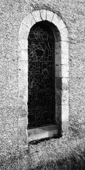 Detail of doorway converted into window in nave's NW elevation.