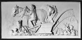 Interior.
Ground floor, entrance lobby, view of nineteenth century plaster panel representing horses, plough, farmhand and dog.