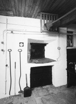Interior.
View of oven and implements.