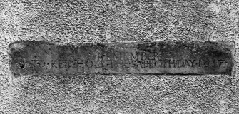Detail of 1637 date inscription over W door.