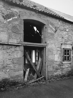 Detail of original arched opening in threshing barn.