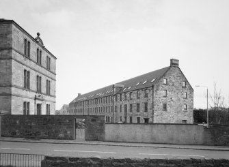 General view of  mill (right) and office (left) from W
