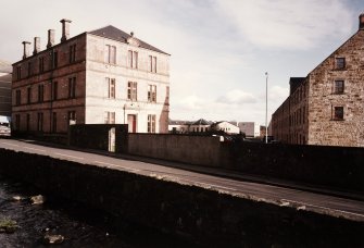 View from SW of former office (left) and mill (right) with Lower Mill Street in foreground