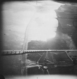RAF WWII oblique aerial photograph of the south end of the Kincardine Bridge.  Visible are two pillboxes protecting the approach to the bridge.