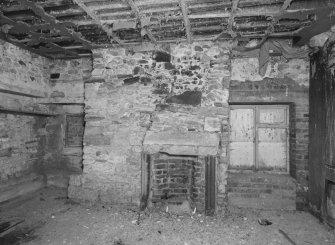 Interior. Detailed view of fireplace at NE end of 1st floor in warehouse ('Room 10')