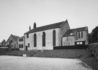 View from South East showing former church, halls and former graveyard