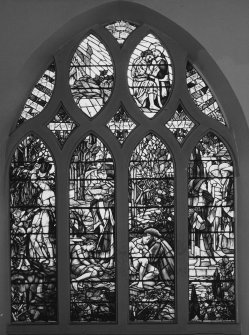 Interior. N wall W  stained glass window depicting the Good Samaritan by Christopher Whall 1896