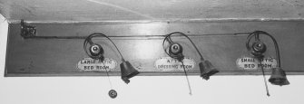 Interior.
Detail of range of service bells in ground floor passage.