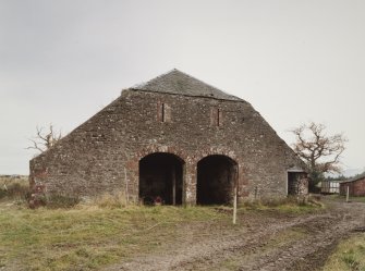 View of barn from SW, showing 2 cart bays and half-hipped gable.