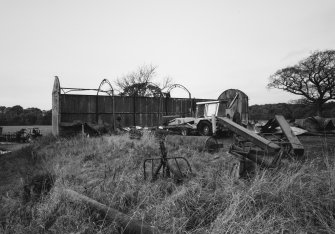 View of sheet-metal barn during demolition.